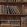 Book Shelves Wallpaper by MINDTHEGAP Brown Multi