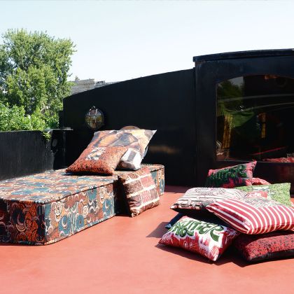 Paris So Metis fabric on outdoor pouffe and cushions