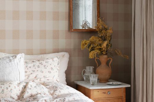 Terracotta gingham wallpaper in a bedroom