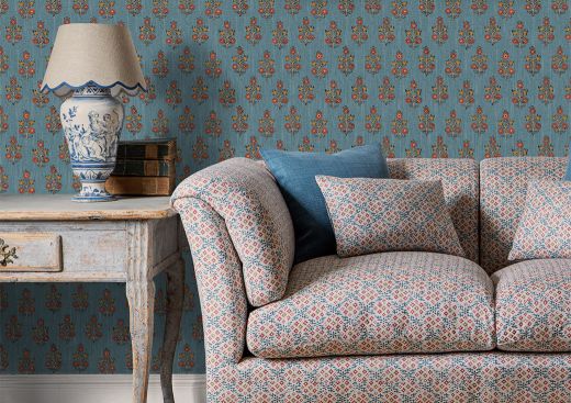Sofa upholstered in Grantly fabric and Poppy Sprig wallpaper, both GP & J Baker