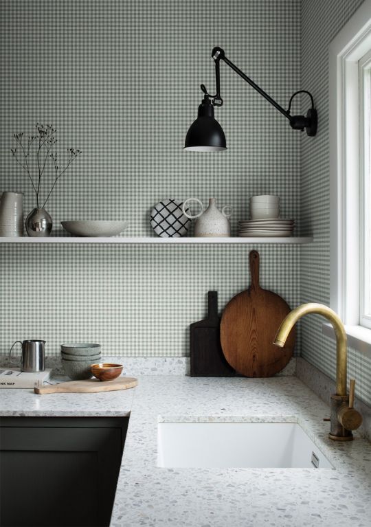 A kitchen with green small gingham wallpaper by Sandberg